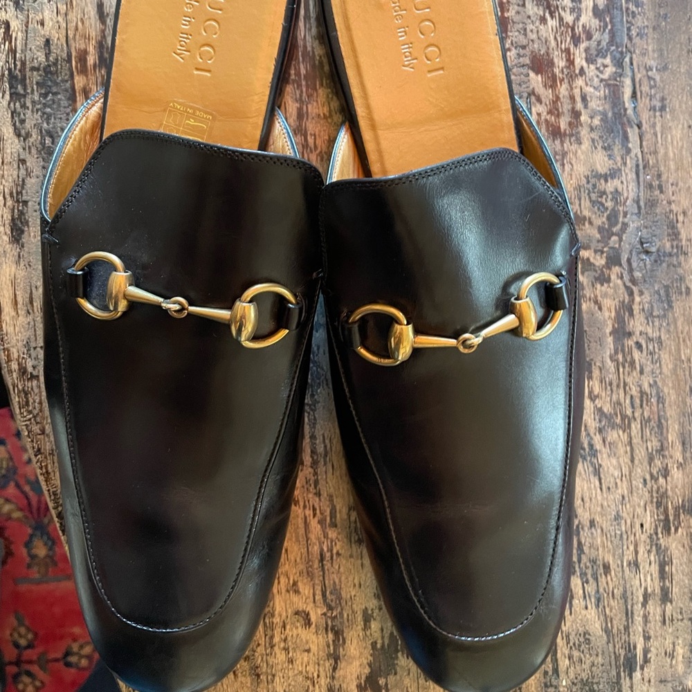 Gucci leather horsebit slippers.
